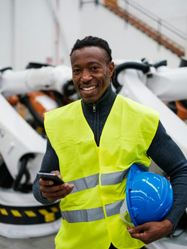 Industry worker using smartphone during his break